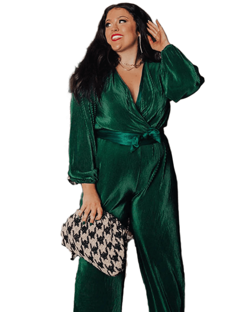 Front of a model wearing a size 1x Dark Green Plus Size Pleated Satin Belted V Neck Jumpsuit in Green by Très Chic. | dia_product_style_image_id:319837